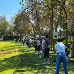 A packed driving range on a sunny day. Our facility can easily accommodate large groups for corporate events or private parties.