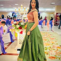 A timeless memory, beautifully reimagined. We had the honor of transforming our client's mother's precious saree into this elegant olive green lehenga with a contrasting brocade blouse. This is a full view of the final creation, perfect for any grand celebration.