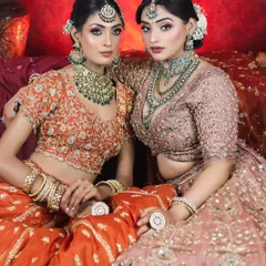 This photoshoot showcases two distinct but complementary bridal makeup looks. I used earthy tones and emerald green accents to create a cohesive and luxurious aesthetic, perfect for a high-fashion bridal editorial or for sisters getting ready together.