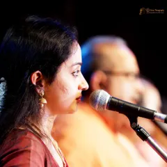 Here I am performing the Nattuvangam, conducting the recital with rhythmic syllables, for my student's debut. This is a vital part of the live performance experience I provide for my students.