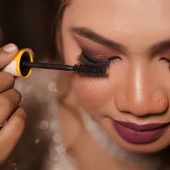 Applying mascara is a crucial step to make the eyes pop. This macro shot shows the detail and care I put into every step of the makeup application.