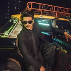 A cool, candid shot of Ranveer getting out of a classic Mumbai taxi. The all-black ensemble looks even more striking against the city lights, showcasing my approach to on-location celebrity shoots.