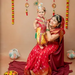 A beautiful moment between mother and son, recreating the bond of Yashoda and Krishna. I love including parents to add emotional depth to these traditional photoshoots.