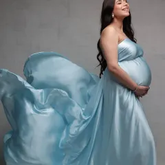 Capturing the beautiful glow of motherhood. For this maternity shoot, we aimed for an angelic and soft look. I used gentle highlighting to accentuate her features and styled her hair in soft, flowing waves to match the ethereal feel of her satin gown.