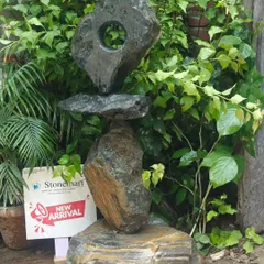 Our "Balance of Life" abstract garden sculpture is shown here in a lush green setting. This piece is a perfect example of modern landscaping art, adding a touch of intrigue and sophistication.