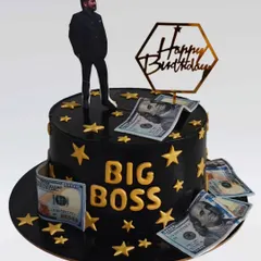 A "Big Boss" themed cake in black and gold. This whipped cream cake is decorated with edible money and stars, perfect for celebrating a husband's success.