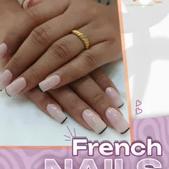 A modern take on a timeless classic. These long, square-tipped nails feature a clean French manicure with a sharp, thin black line separating the tip for an edgy look.