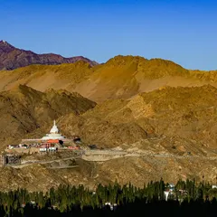 The iconic Shanti Stupa nestled in the golden-brown hills of Ladakh. We often run or hike to these cultural landmarks as part of our acclimatization schedule.