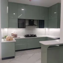 This shot captures the full scope of the U-shaped kitchen with its breakfast bar. The design demonstrates our ability to create highly functional work triangles while maintaining a beautiful, cohesive look.
