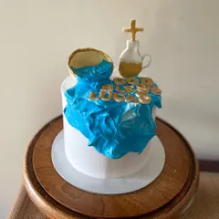 Another view of the Holy Communion cake, showing the custom gold lettering.