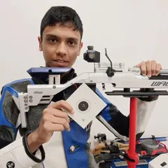 Our 13-year-old shooter Shiven Kumar during a training session at our Delhi branch, holding his target with pride.