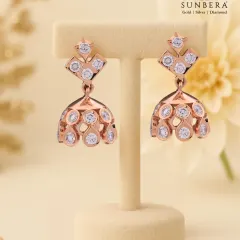 Modern jhumka-style earrings crafted in rose gold and studded with diamonds. The design offers a contemporary twist on a traditional favourite, perfect for festive occasions and parties.