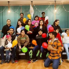 A happy moment captured during a New Year's party at the studio. The tiered seating and open floor can comfortably accommodate groups for celebrations, making everyone feel part of the fun.