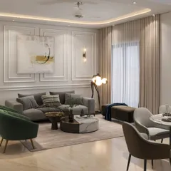 An elegant living room with a neutral color palette, featuring a grey sofa, green accent chairs, and a marble-top coffee table. The classic wall molding and contemporary art create a sophisticated and balanced interior.