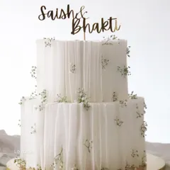 This two-tier Nutella Hazelnut cake is all about clean lines and delicate details. I used edible wafer paper to create a soft, draped fabric effect, dotted with tiny sprigs of baby's breath for a touch of minimalist elegance.