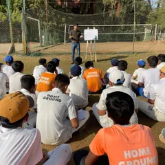 The players, wearing their Homeground jerseys, are fully engaged in the workshop. We believe in a holistic approach to cricket coaching that includes both physical and mental training.