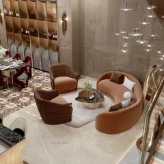 A double-height living and dining area creates an immediate sense of grandeur. We designed this space to feel open and luxurious, perfect for hosting family dinners or formal events, with a stunning staircase and curated furniture that complements the scale of the room.
