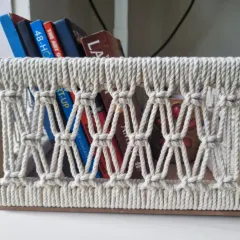 Another view of the macrame basket as a book holder, keeping your current reads tidy and accessible.