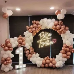 Celebrate your union with this 'Better Together' neon sign backdrop. The circular balloon arch in rose gold and white, paired with a large light-up number '1', makes this a great setup for a first anniversary or engagement party.