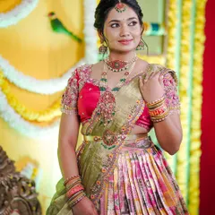 The complete 'Bhale Shastra' look. We designed this traditional langa davani (half saree) with a heavily worked blouse to create a vibrant and festive ensemble for the ceremony.