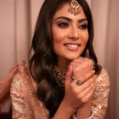 A soft and dreamy glam look. The shimmery pink eyeshadow and glowing skin create a beautiful, ethereal vibe perfect for a special occasion.
