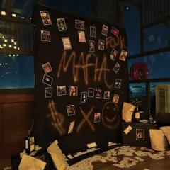 A "Godfather Gala" themed party photo booth. We created a moody, interactive backdrop with graffiti, scattered money, and polaroids for guests to take memorable, in-character photos.