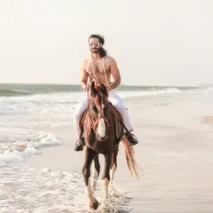 An extensive editorial series of a male model with a horse on the beach. I used a mix of color and black and white, along with varied poses, to create a powerful narrative of untamed strength and freedom.