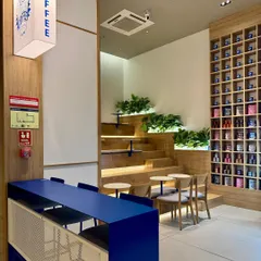 To translate the young, energetic vibe of the coffee brand Beanly into their first physical cafe, we designed this dynamic, multi-level stepped seating. This feature makes clever use of a compact, triple-height space, creating an informal and approachable lounge area that encourages customers to linger.
