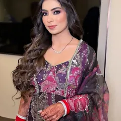 The complete look. The dramatic eye makeup is balanced with a soft pink lip and glowing skin, creating a look that is both bold and beautiful.