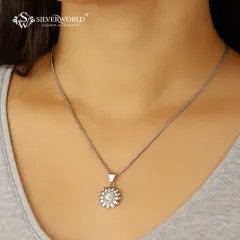Our sunburst pendant on a simple silver chain is designed to shine. This piece is perfect for adding a touch of brightness to your everyday look, whether worn alone or layered with other necklaces.
