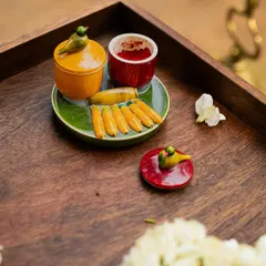 A charming, handcrafted ceramic set for kumkum and turmeric, featuring tiny bird motifs. Sourcing such unique, artisanal pieces is how I ensure that even the most traditional elements of a ceremony feel fresh and personal.