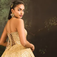 The back of the Jules Dress reveals its corset construction. The delicate lace-up detail is not just functional for a perfect fit but also adds a romantic, classic element to this modern dress.