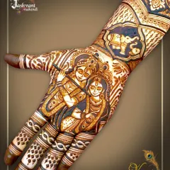 For a touch of divine love, I specialize in mythological artistry. This detailed palm design features a beautiful portrait of Radha and Krishna, surrounded by fine-line fillers and a traditional elephant motif on the wrist.
