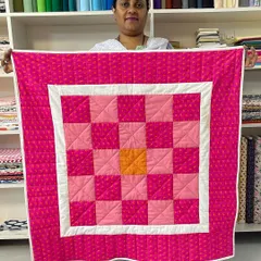 A straight-on view of the beginner's checkerboard quilt, showing the clean lines and simple, effective pattern.