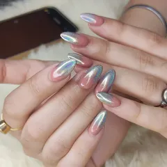 Holographic chrome is perfect for when you want your nails to truly stand out. This look features a beautiful ombré blend from a natural pink base to a dazzling silver holographic chrome tip on almond-shaped extensions. The way it catches the light is just incredible.