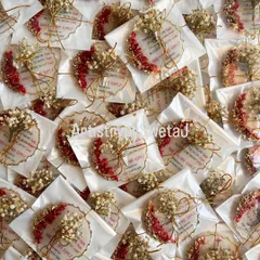 A sea of blessings. This image shows the full batch of 100 baptism return favors, each one individually wrapped and ready to be gifted.