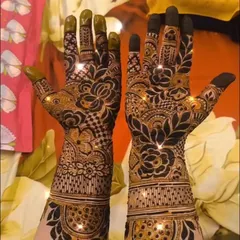A sparkling finish on a detailed floral and checkerboard pattern. This design covers the hands and wrists with a mix of modern and traditional elements.