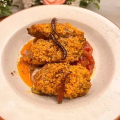 Our Panko Butter Baked Masala River Sole is a unique take on fish. A delicate river sole fillet gets a crunchy, buttery panko crust and is baked on a bed of grilled tomatoes and onions for a complete dish.