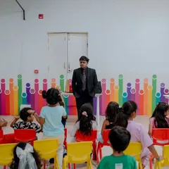 This is my typical setup for a kids' birthday party show. I bring everything I need to create a stage-like experience, even in a simple party room, ensuring all the children have a great view of the magic.