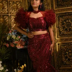 The intricate sequin work and ruffled sleeves make this outfit a true showstopper.