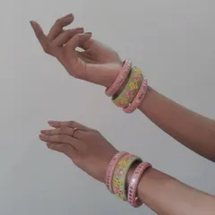 My handmade bangles are designed to be stacked and mixed. This set features pastel green and pink threadwork with delicate floral and sequin details, perfect for matching with sarees or lehengas.