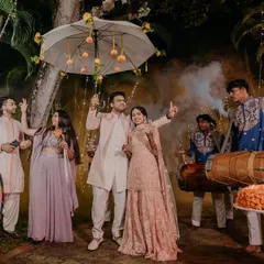 The couple's festive entry to their Mehendi ceremony, accompanied by dhol players and surrounded by friends and family. The atmosphere was electric with joy and anticipation.