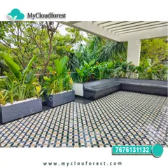 I used bold, patterned floor tiles to make a statement on this large terrace. The geometric design is balanced by minimalist grey planters filled with tropical plants and a built-in L-shaped bench, creating a sophisticated and contemporary outdoor living area.