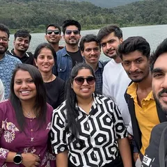 Making new friends by a serene lake in Chikmagalur. My trips are perfect for solo travelers looking to meet like-minded people.