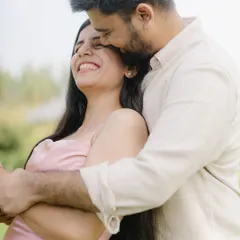 A tender embrace filled with genuine smiles. I aim to create a comfortable space where couples can just be themselves, allowing me to capture their natural affection.