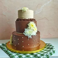 Another view of the wedding cake, showing how the different shades of chocolate frosting complement each other.