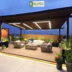 The same Gurgaon pergola at dusk, showcasing the beautiful linear lighting design that creates a warm and inviting atmosphere for evening relaxation.