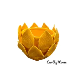 This beautiful tea light candle holder, shaped like a lotus with detailed leaves, adds a warm glow to any setting. This yellow ceramic piece is perfect for festive decor or creating a cozy ambiance.