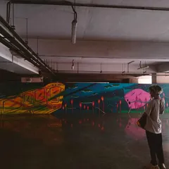 Looking at my finished mural at the metro station, which was part of the Majhi Metro festival. It is a surreal feeling to see your art become a permanent part of the city's landscape, interacting with thousands of people every day.