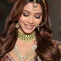A serene moment captured, focusing on the soft yet impactful eye makeup. The blended eyeshadow and full lashes create a dreamy, romantic feel, perfect for a bride on her big day.